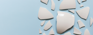 White pieces of broken pottery on a light blue background